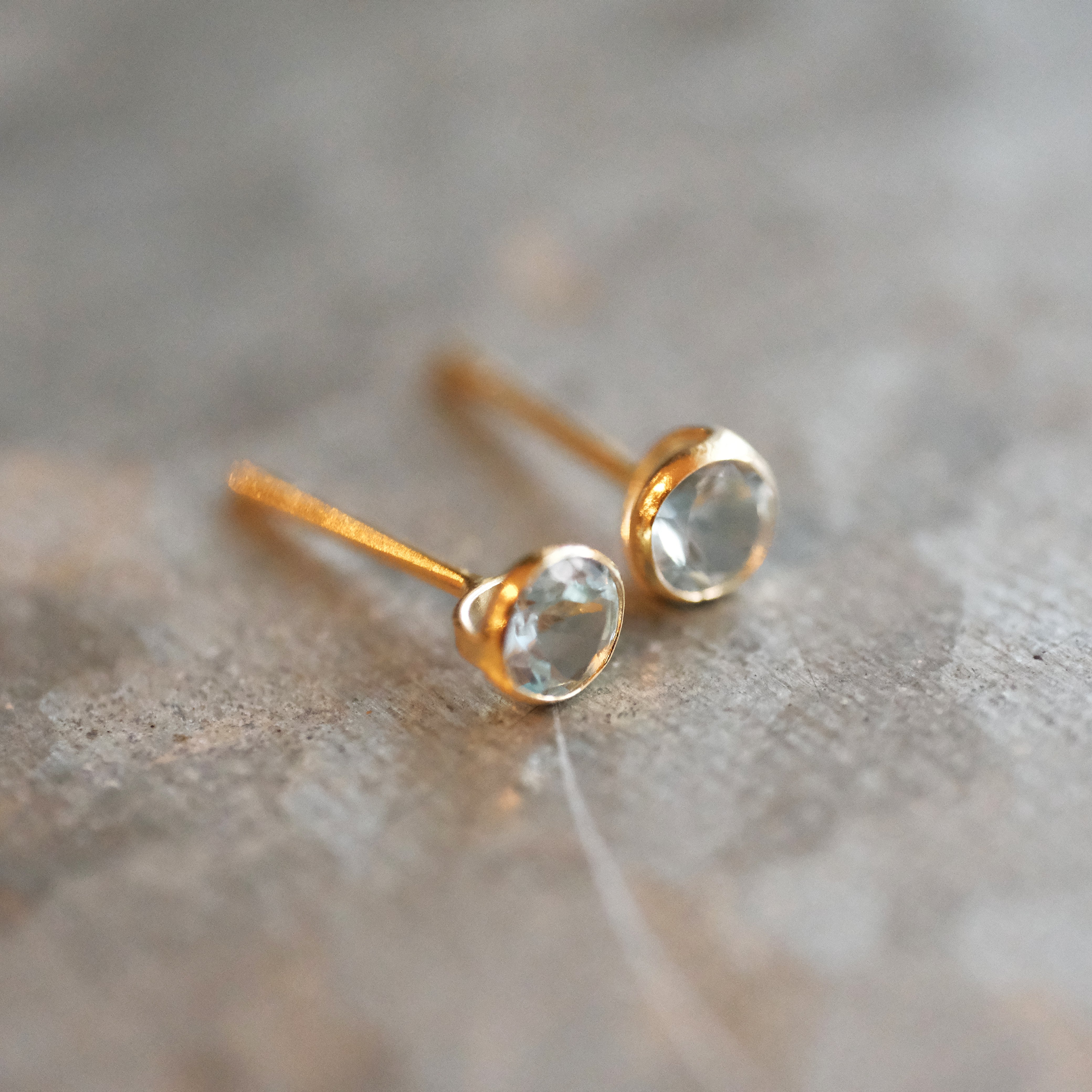 14k + Sky Blue Topaz Saddle Studs
