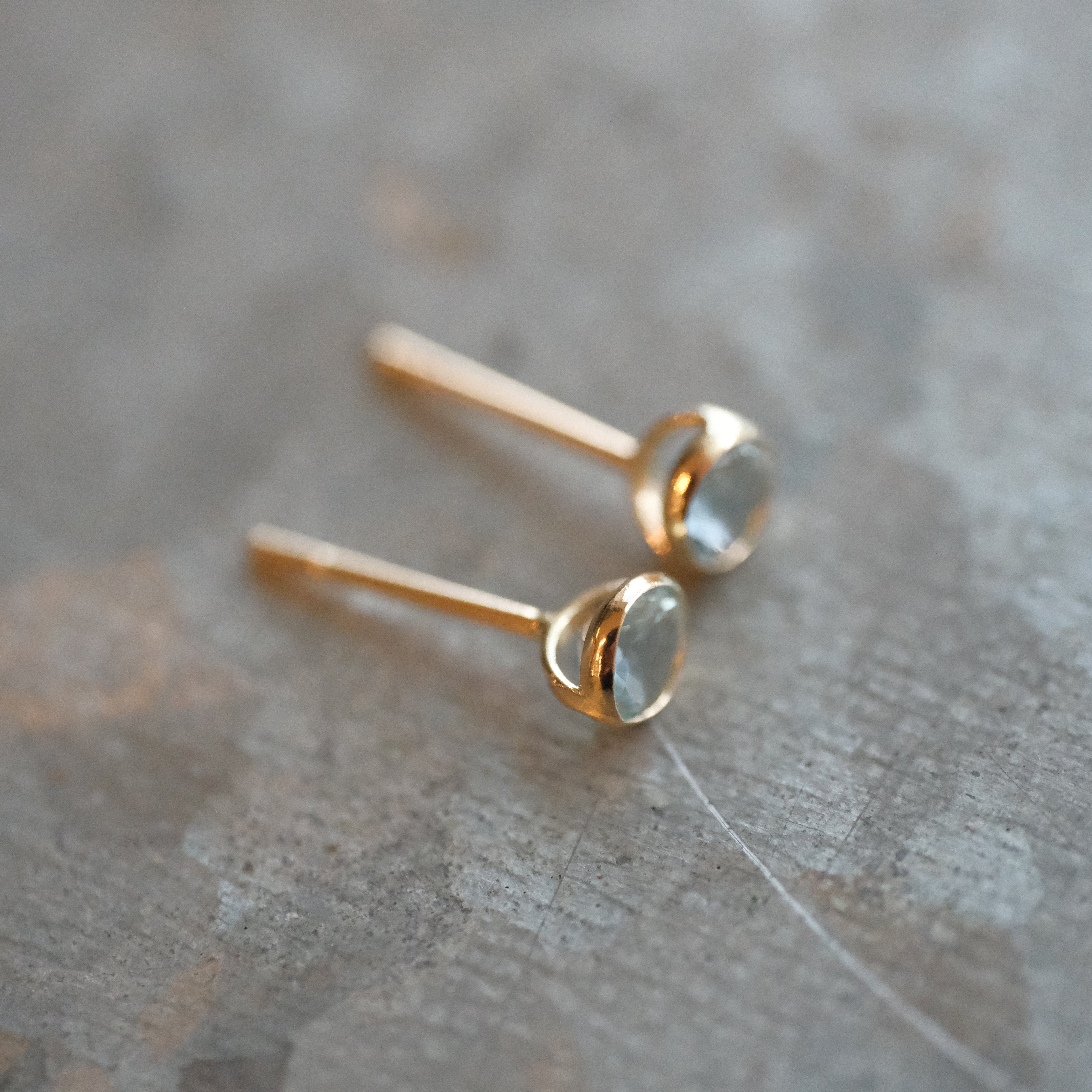14k + Sky Blue Topaz Saddle Studs