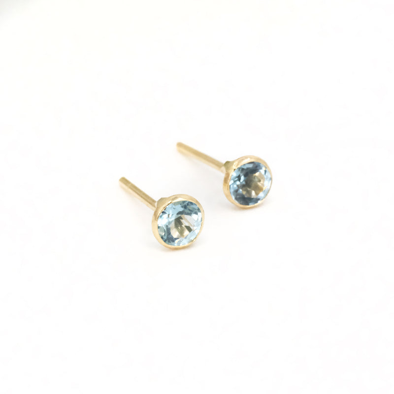 14k + Sky Blue Topaz Saddle Studs