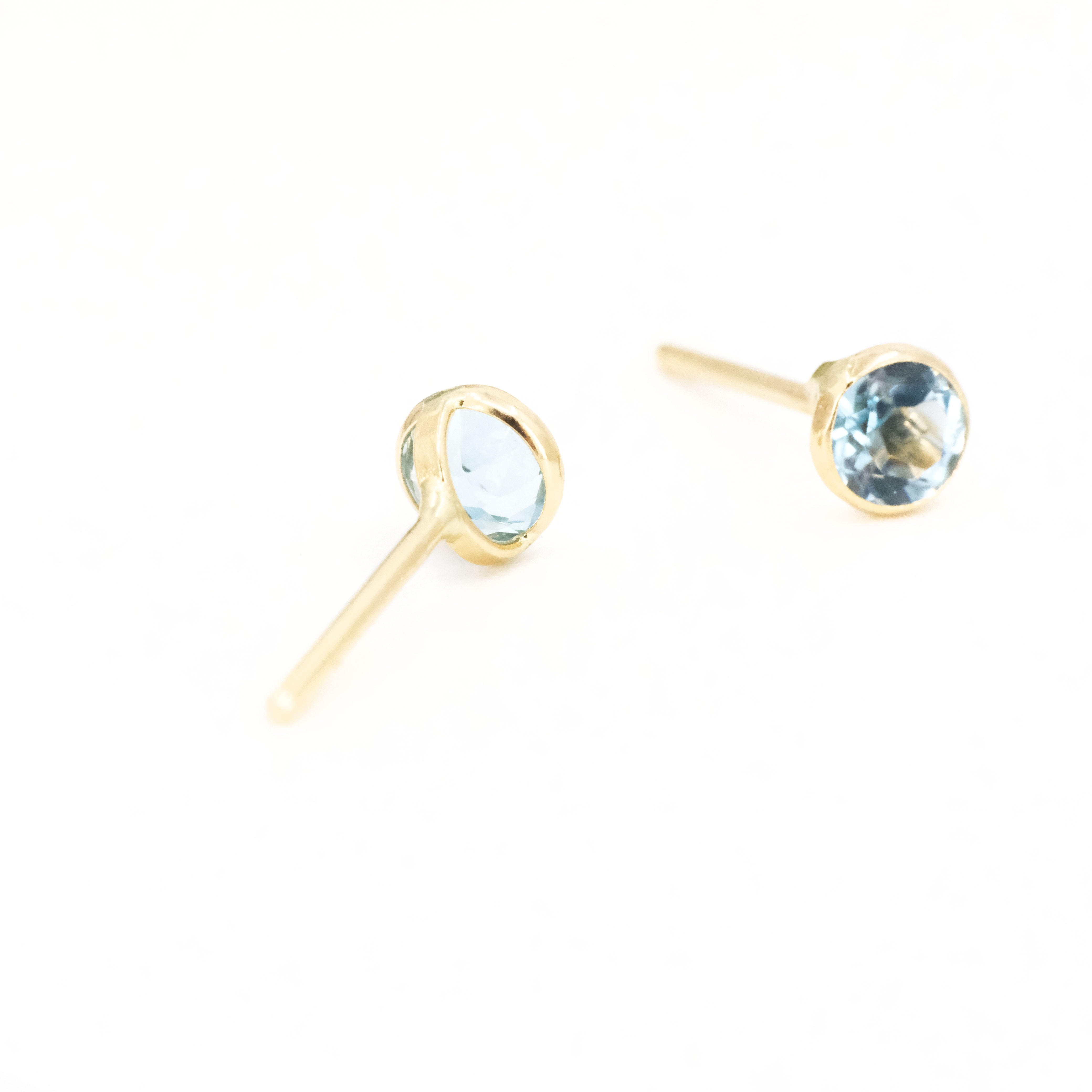 14k + Sky Blue Topaz Saddle Studs